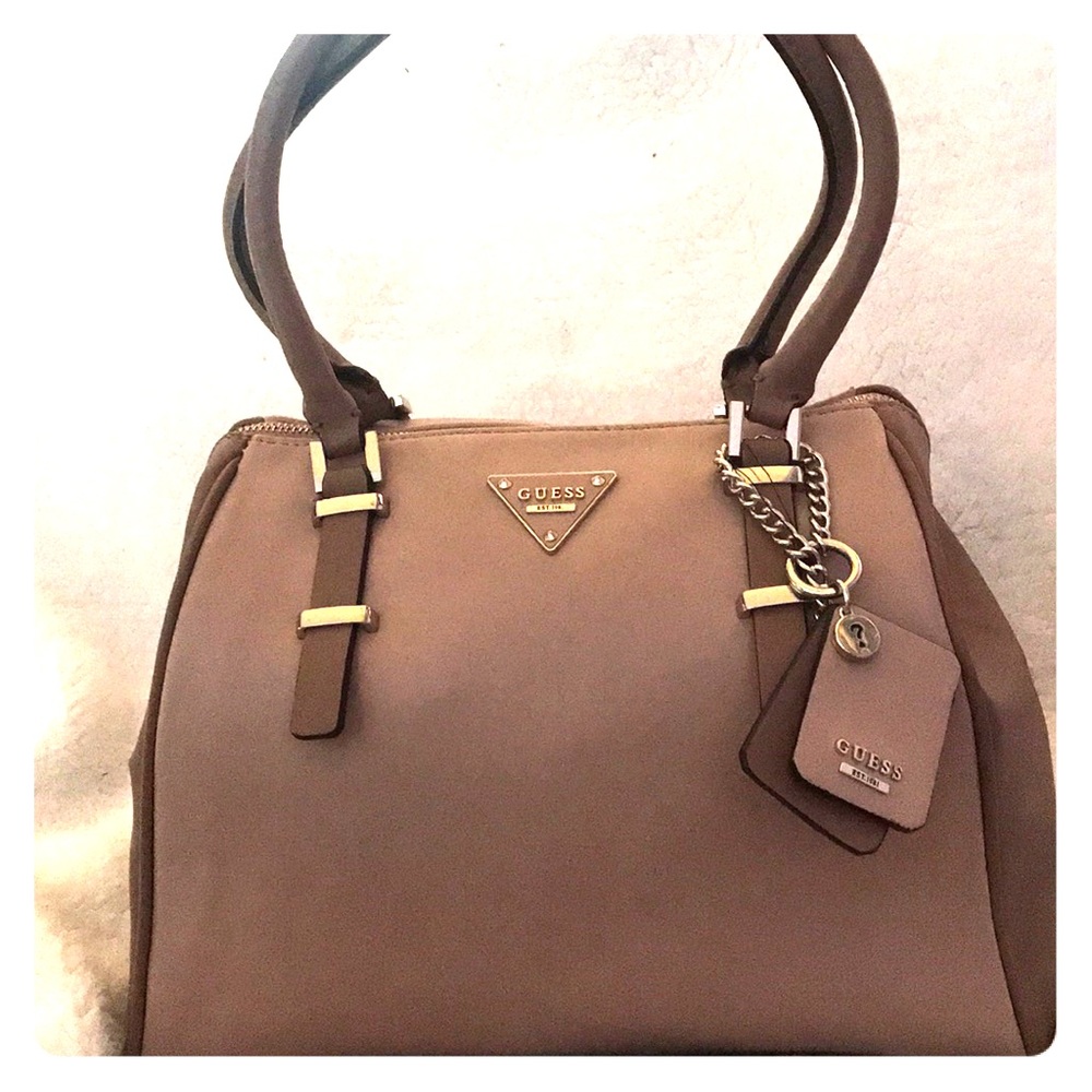 Mauve handbag, slightly used.